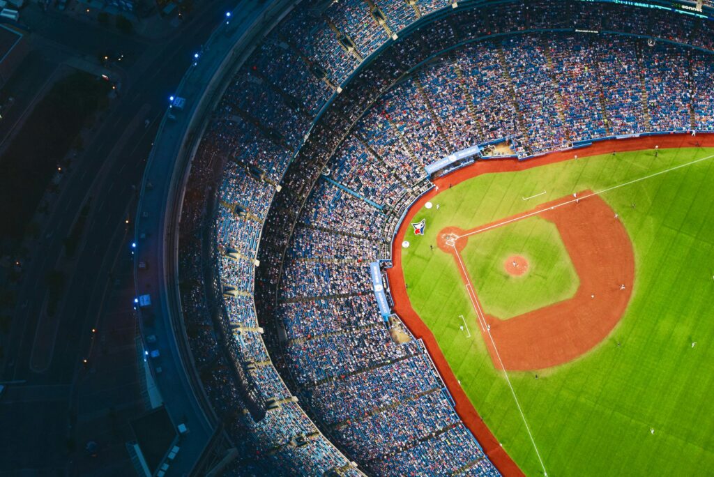 pexels-photo-139762-139762 High-angle view of a crowded baseball stadium with green field in Toronto during a game.